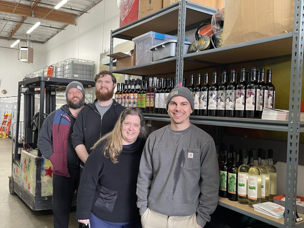 Brovo Spirits founder Mhairi Voelsgen (third from left) with employees Connor (far left), Connor (second from left), and Mac (right).